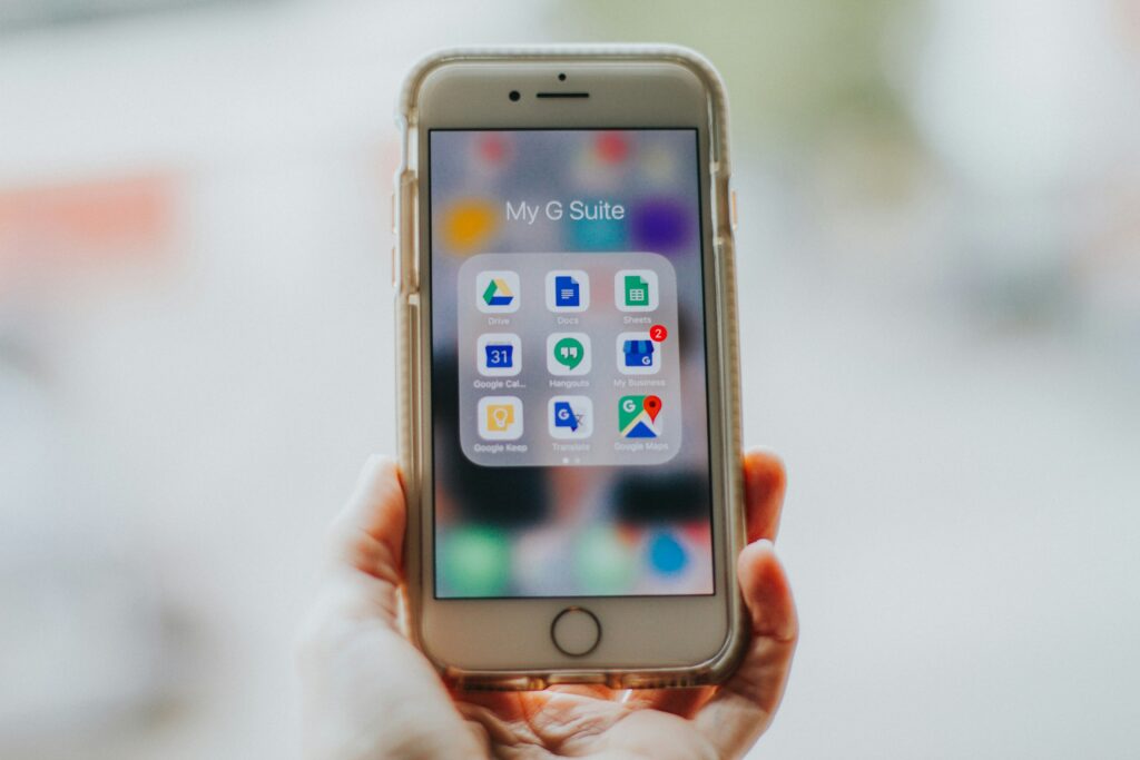 A suite of Google apps on a smart phone including Google Buiness Profile